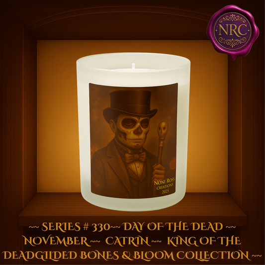 Striking November Catrin King of the Dead candle showcasing a dignified Day of the Dead gentleman in formal mariachi attire and wide-brimmed hat, with intricate sugar skull face paint in rich autumn browns and golds, from the Gilded Bones & Bloom Collection by Noni Ross Creations.