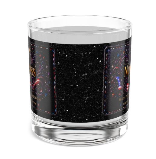 Left side angle of rocks glass with Noni Ross Creations cosmic logo artwork