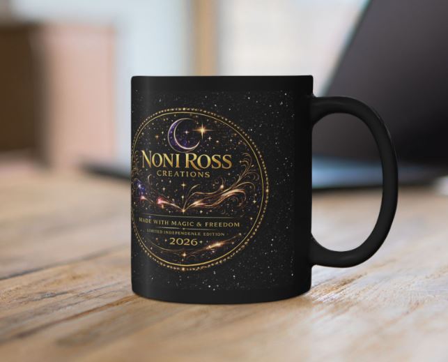 Premium black mug with celestial artwork placed on desk with stylish accessories