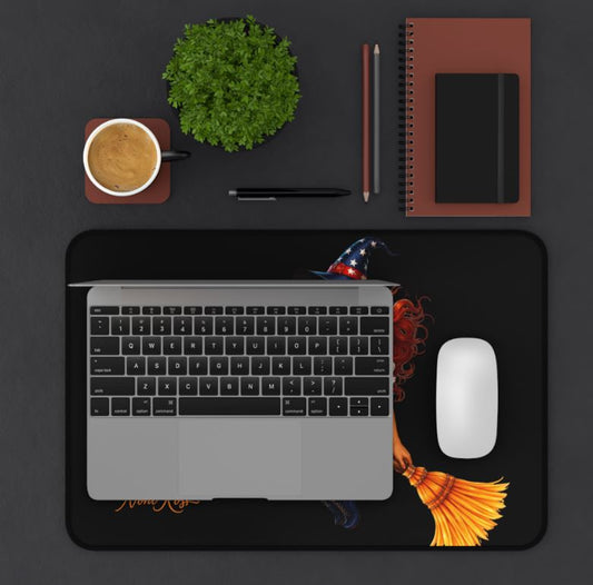 Desk setup featuring patriotic witch desk pad with computer and accessories in modern workspace