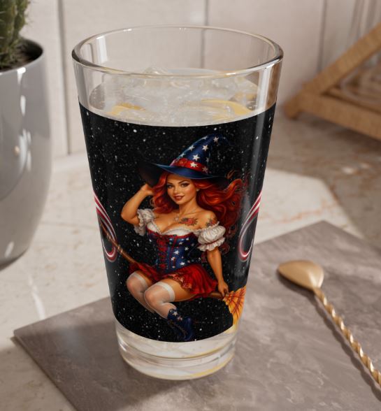 16oz patriotic highball glass styled on table setting featuring vintage pinup witch with red hair and fireworks theme | Noni Ross Creations