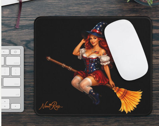 Desk workspace featuring patriotic witch mouse pad with bold red white blue artwork