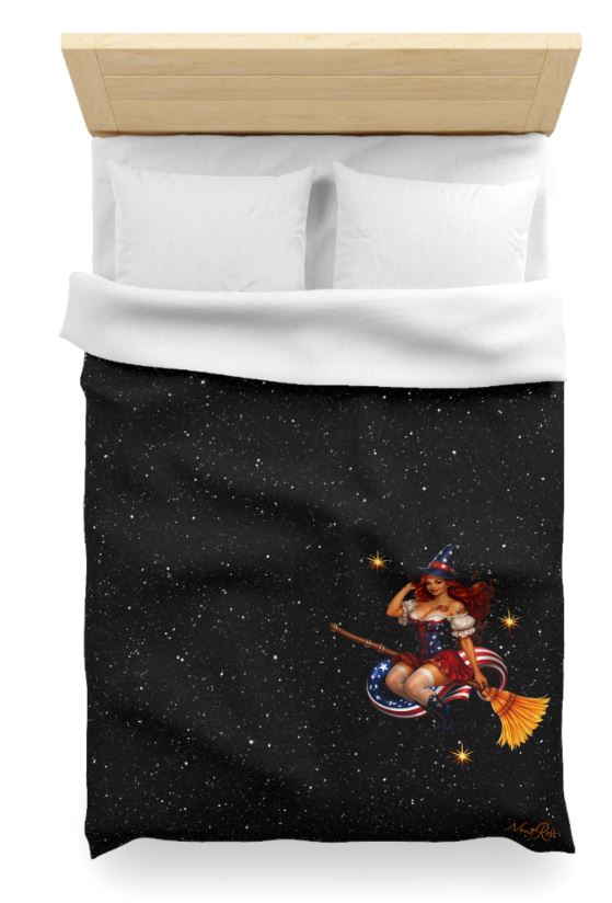 Close-up of minimalist pinup witch bedding showing detailed Noni character on black celestial Twin XL duvet cover
